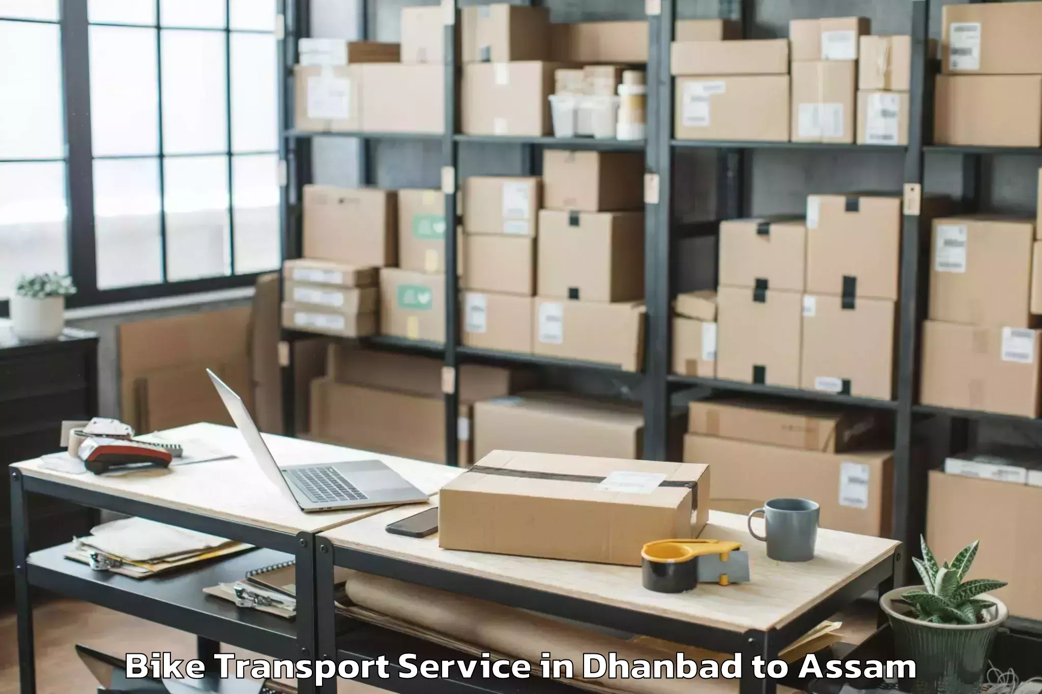 Book Your Dhanbad to Lakhipur Bike Transport Today